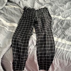 Size: Large (10-12) black and white pants never worn comes with a small belt